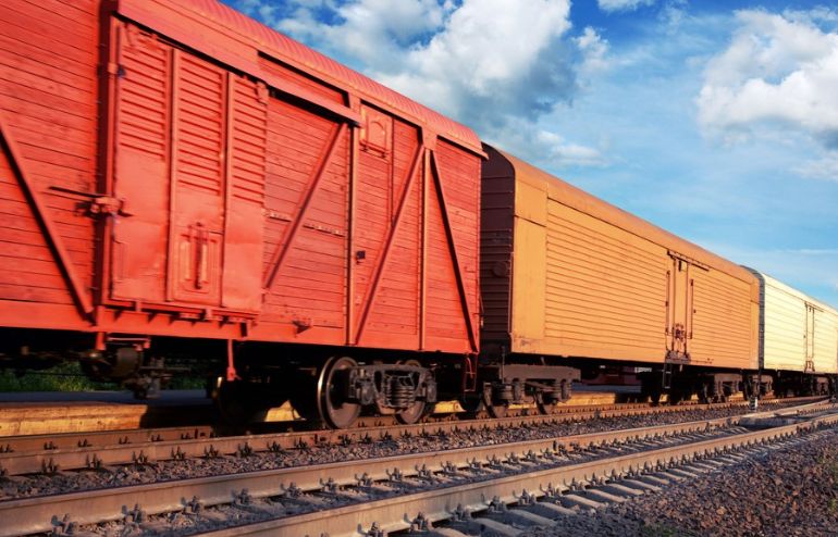 Vibrant red train freight transport on the tracks