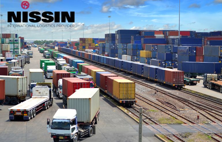 Rail Shipping - A line of vehicles being transported by train